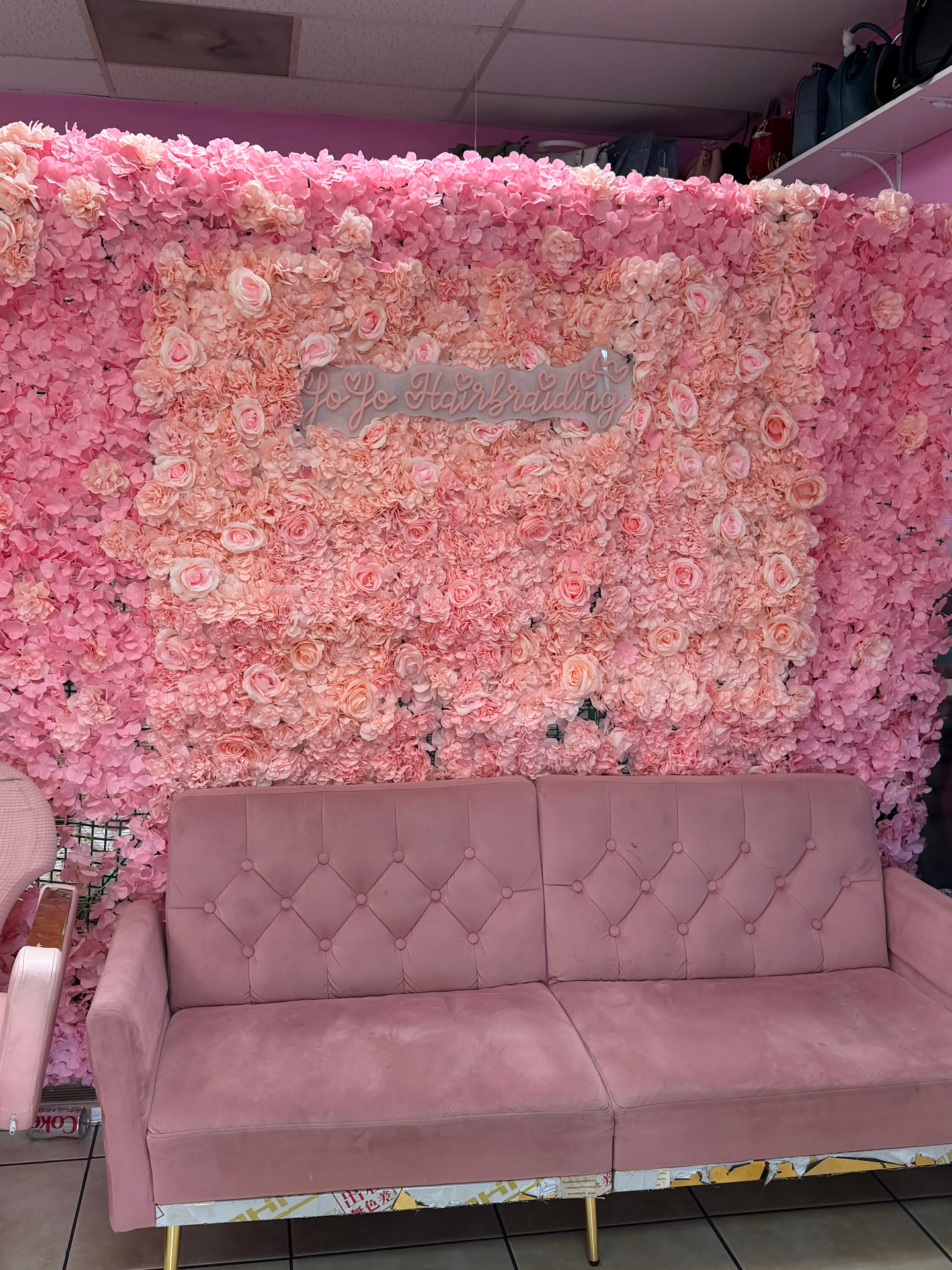 JoJo's flower wall and pink lounge